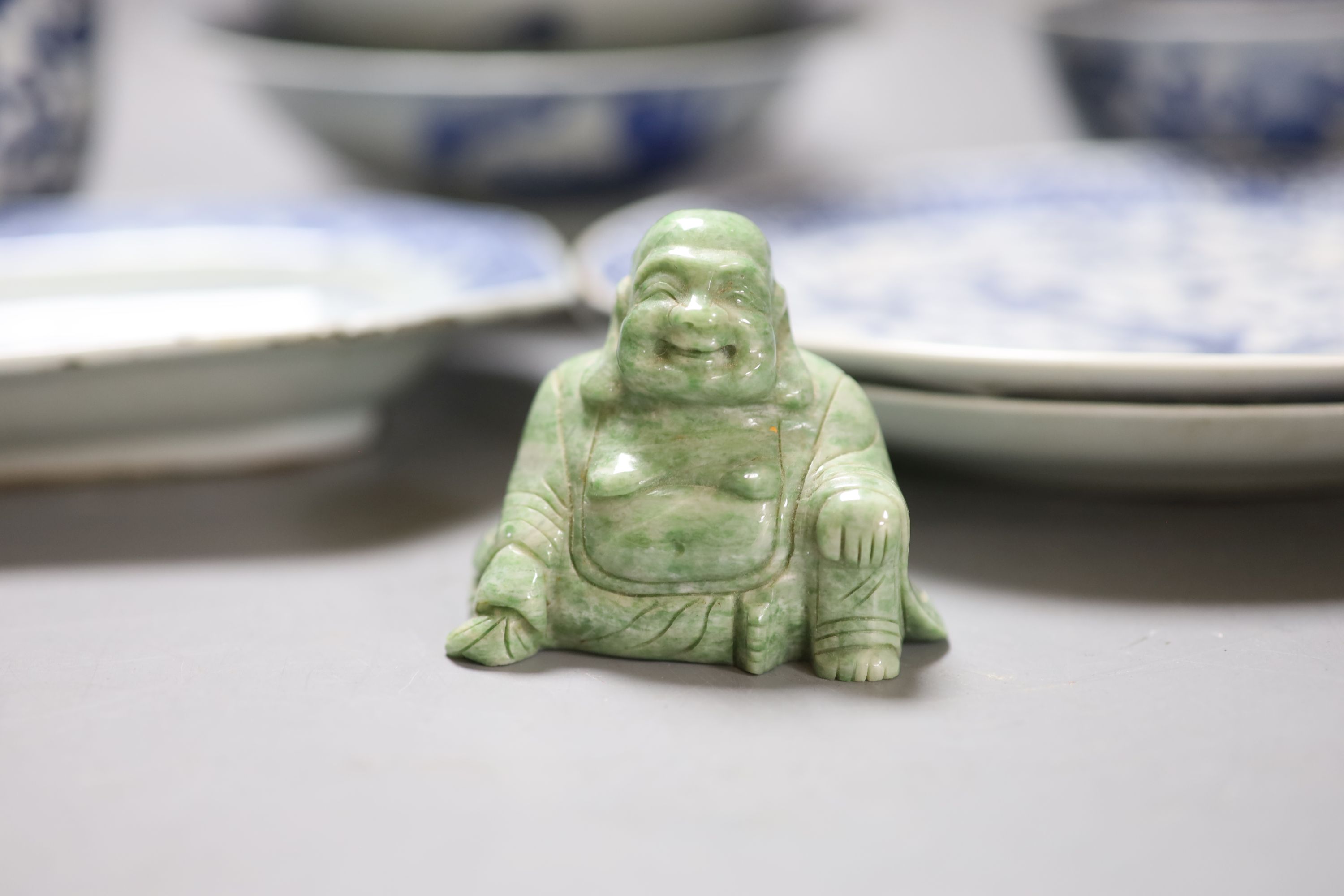 A quantity of mixed Chinese blue and white, together with a hardstone carving of Buddha